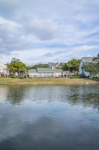 a view of a lake with houses in the back