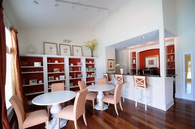 a view of a dining room with furniture and wooden floor