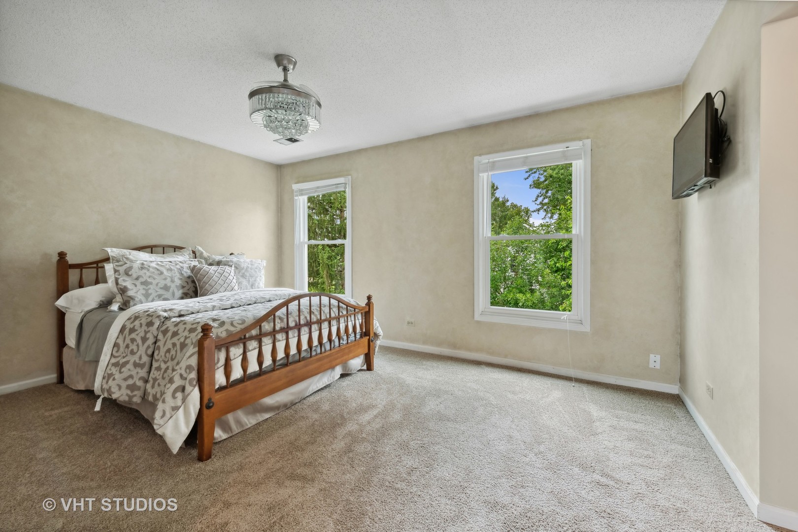 808 Burr Oak Circle Cary, IL 60013 - Photo 11 of 20 a bedroom with a bed and a chandelier