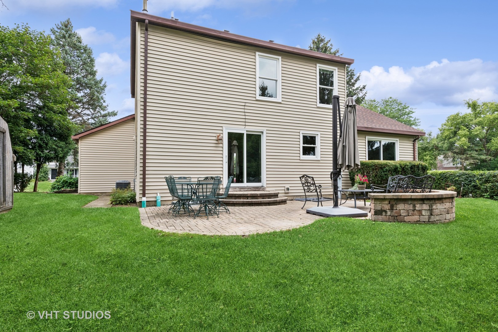 808 Burr Oak Circle Cary, IL 60013 - Photo 19 of 20 a view of a house with backyard and sitting area