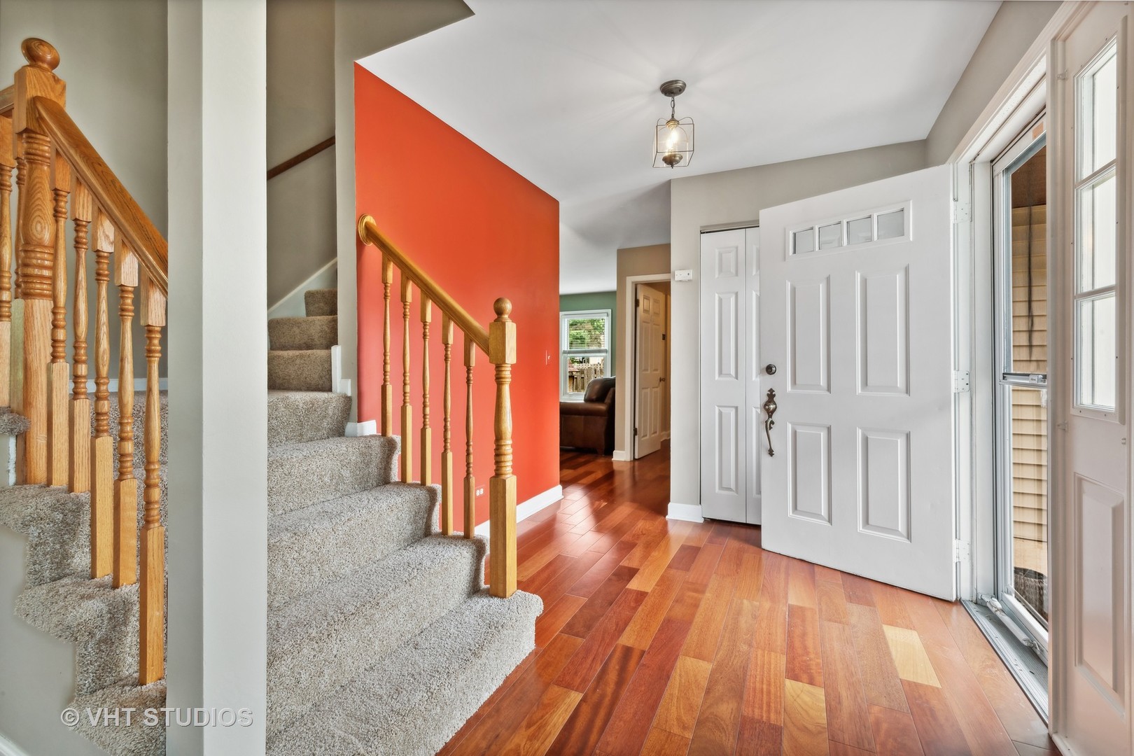 808 Burr Oak Circle Cary, IL 60013 - Photo 3 of 20 a view of a hallway with wooden floor and staircase