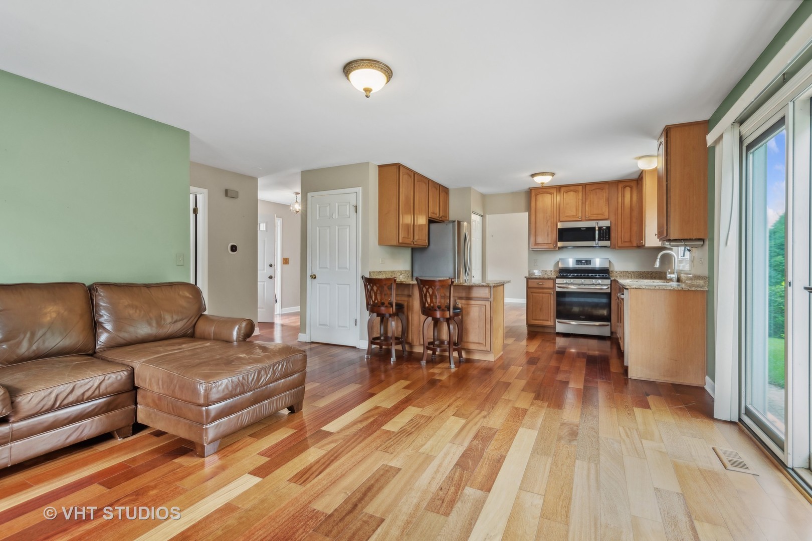 808 Burr Oak Circle Cary, IL 60013 - Photo 8 of 20 a living room with furniture and a wooden floor