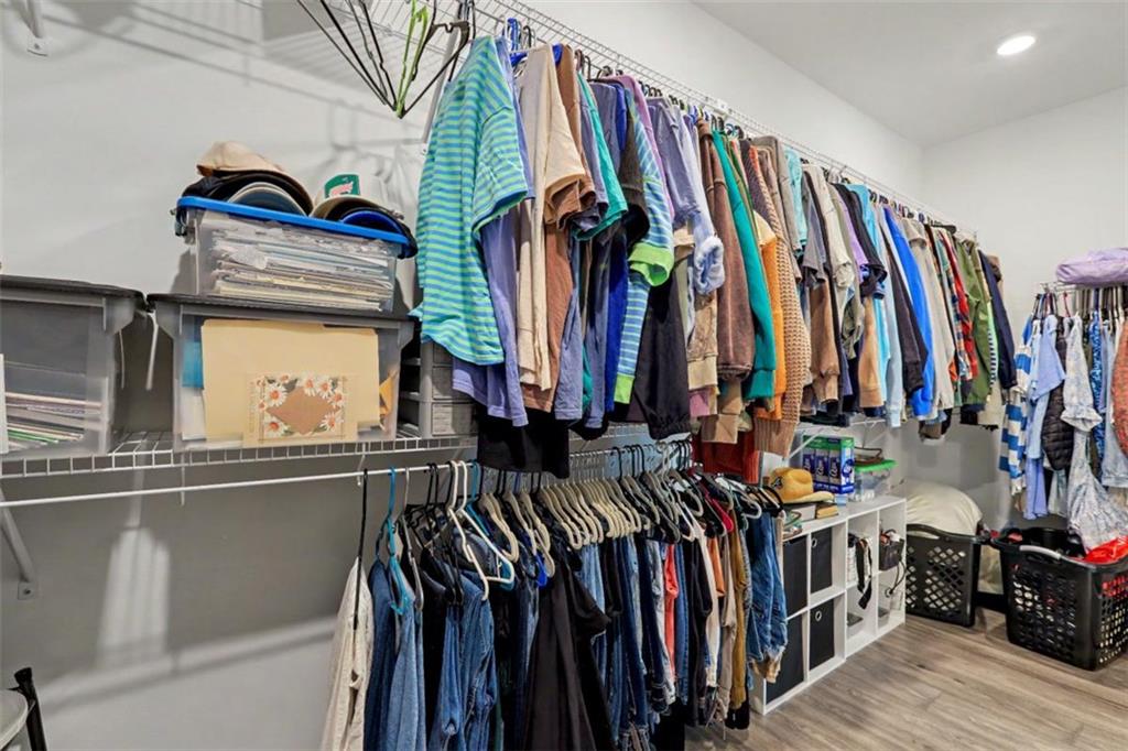943 Clubside Drive Monroe, GA 30655 - Photo 32 of 93 a view of walk in closet with clothes and shoes