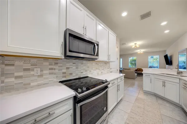 a spacious bedroom with a bed and window