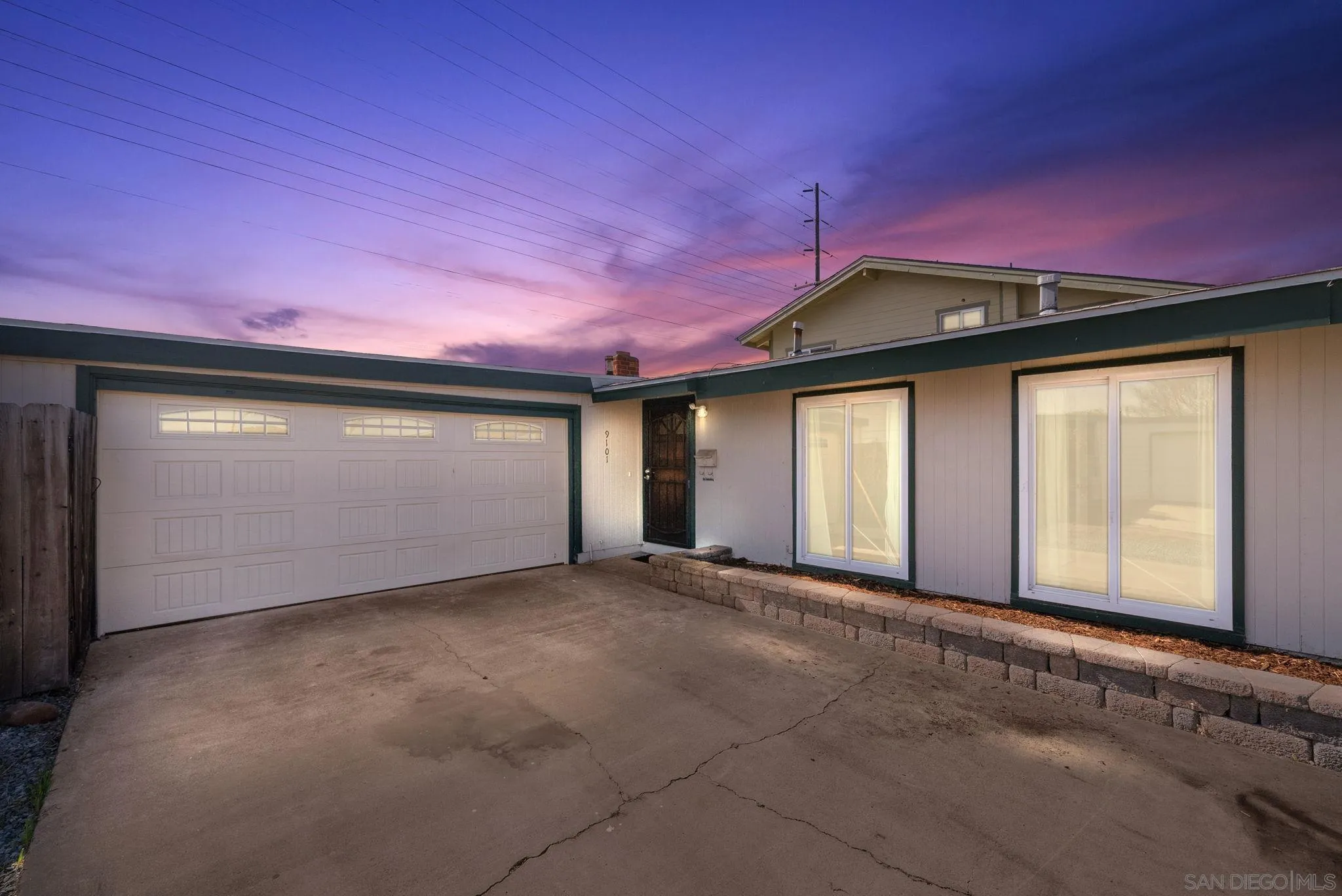 9101 Ronda Avenue San Diego, CA 92123 - Photo 1 of 20 a front view of a house with a big yard