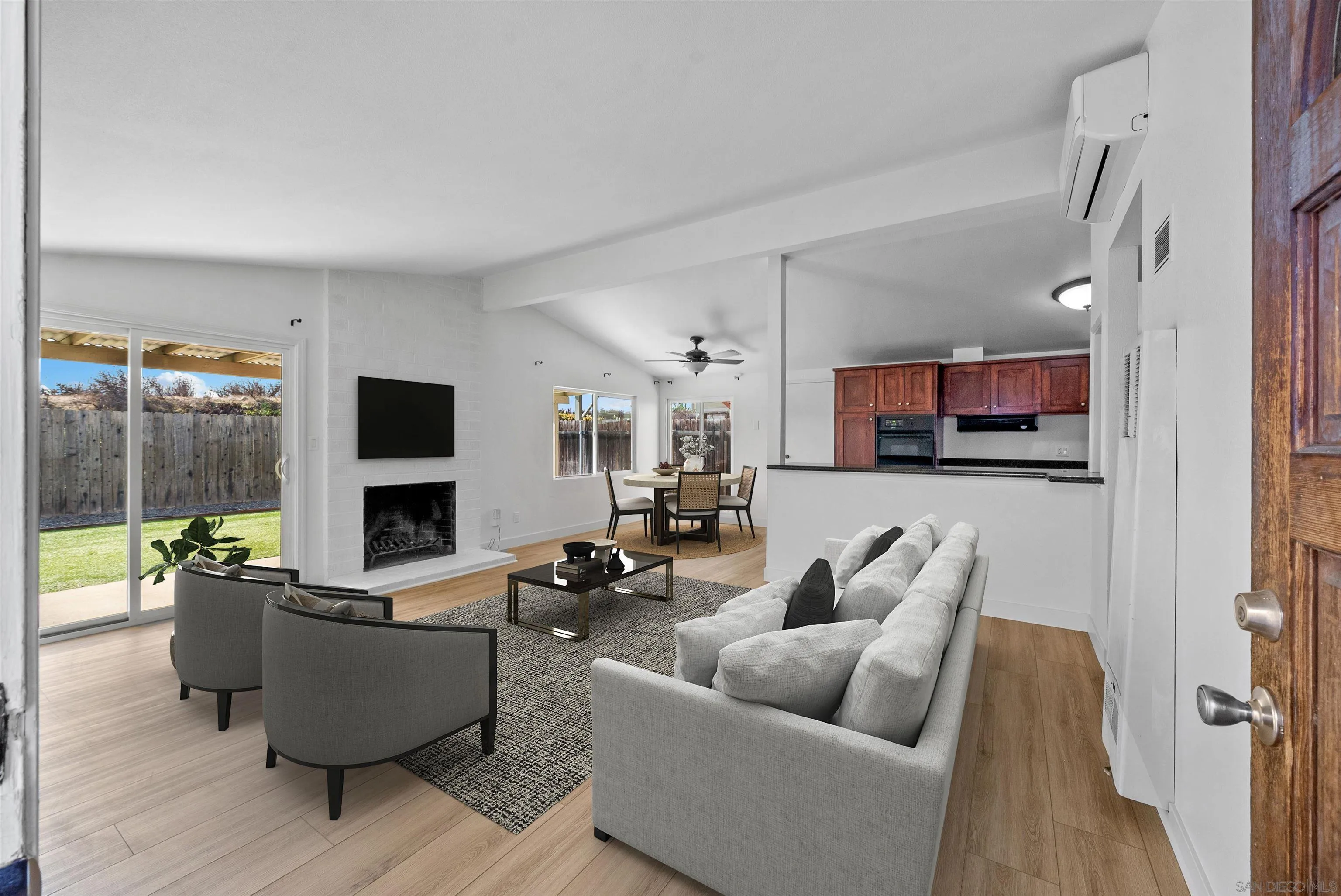 9101 Ronda Avenue San Diego, CA 92123 - Photo 2 of 20 a living room with furniture and a flat screen tv