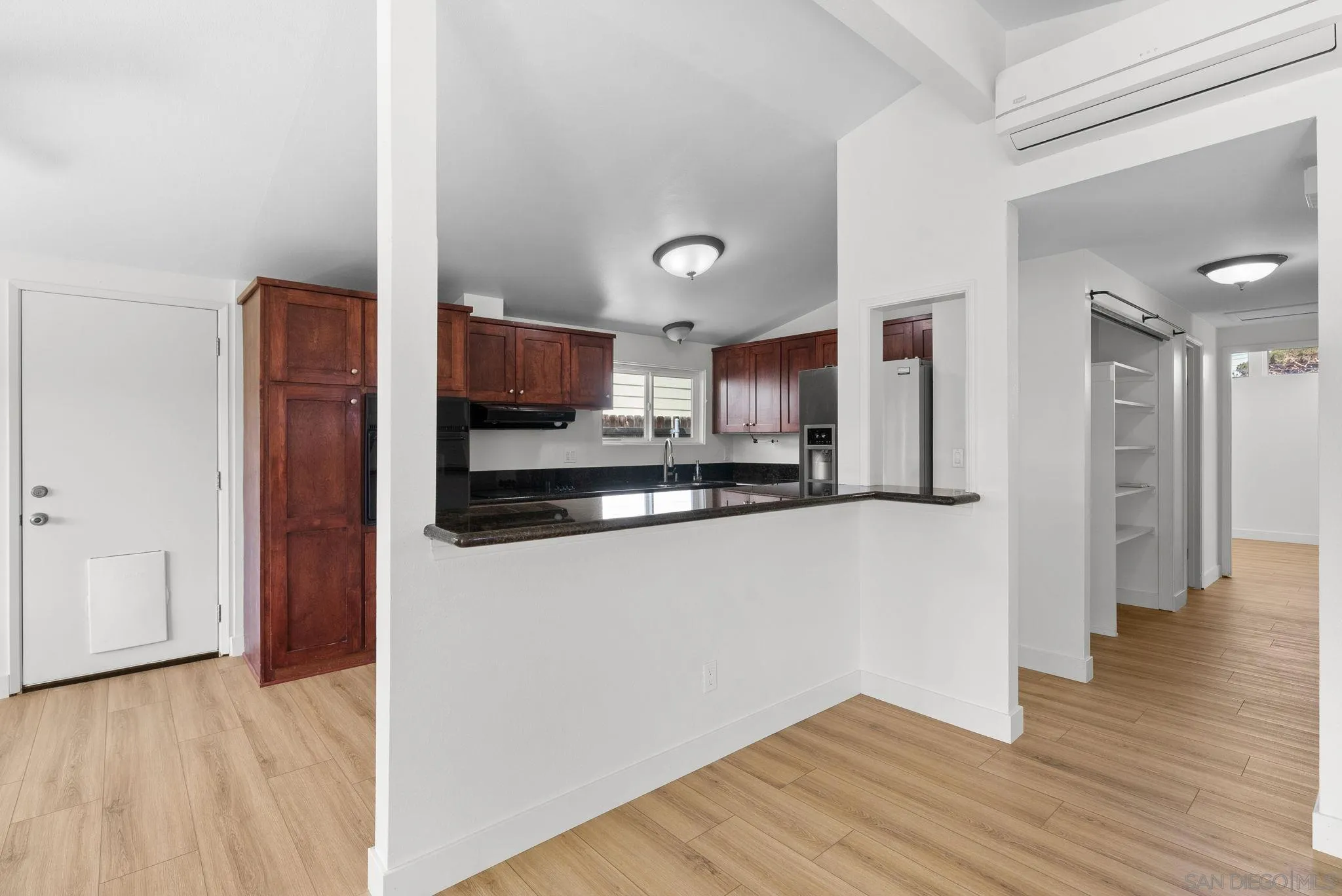 9101 Ronda Avenue San Diego, CA 92123 - Photo 6 of 20 a view of a kitchen with wooden floor