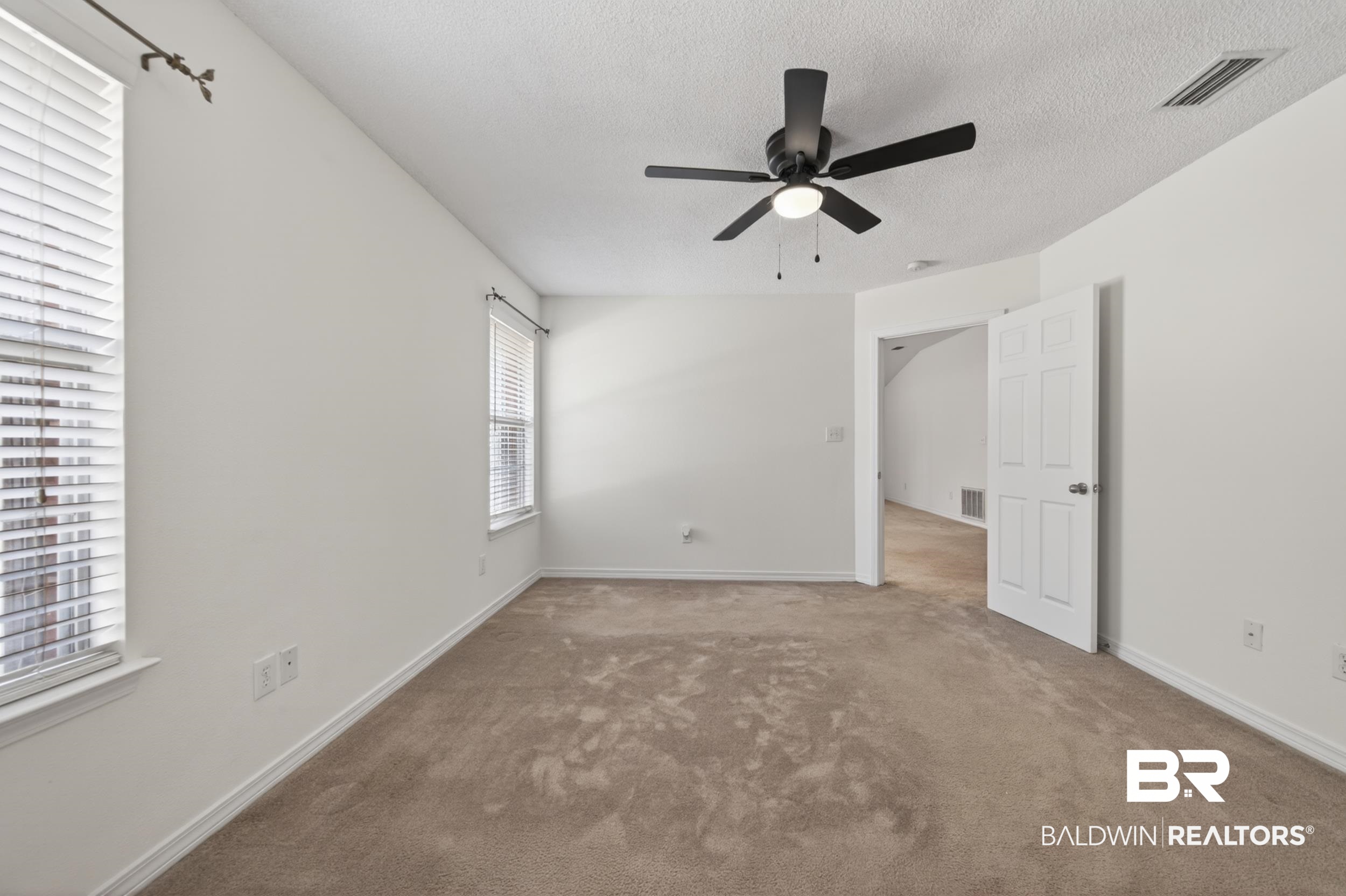 108 Davison Loop Fairhope, AL 36532 - Photo 9 of 17 Unfurnished bedroom featuring carpet, a ceiling fan, and a textured ceiling