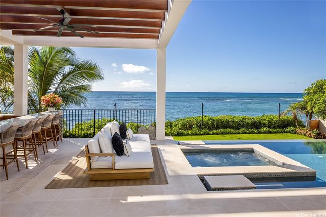 a bedroom with furniture and large windows