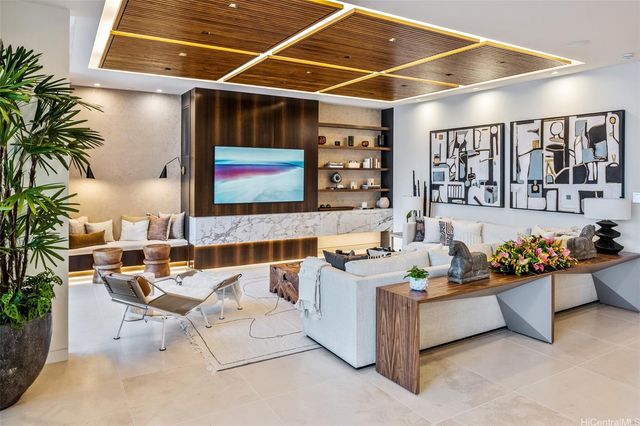 a living room with patio furniture and flowers