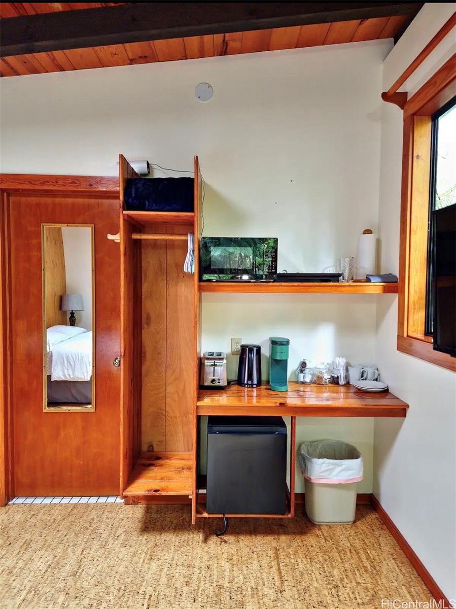 11-3832 2nd Street Volcano, HI 96785 - Photo 13 of 25 a room with furniture and window