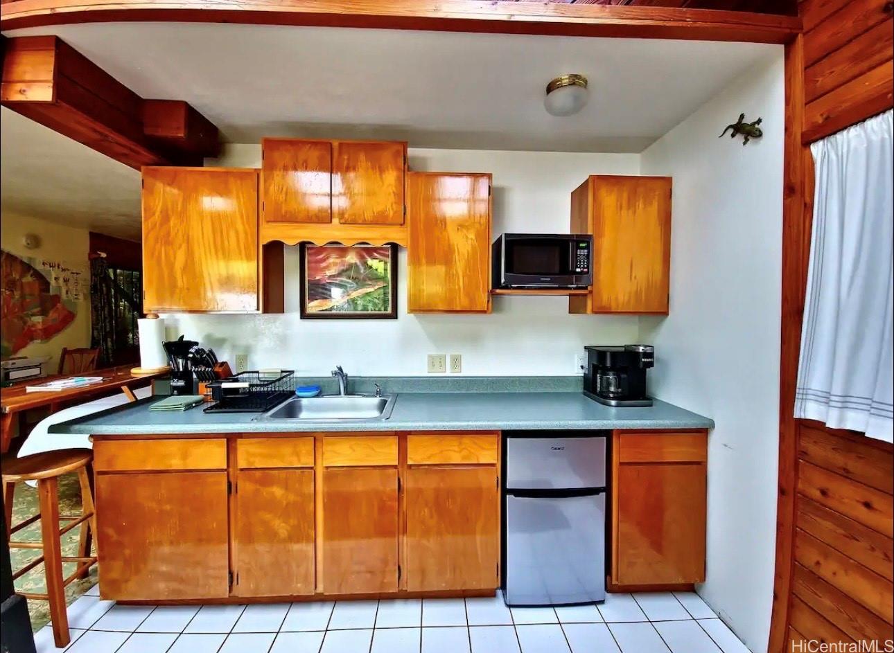 11-3832 2nd Street Volcano, HI 96785 - Photo 16 of 25 a bathroom with a sink a mirror and a bathtub