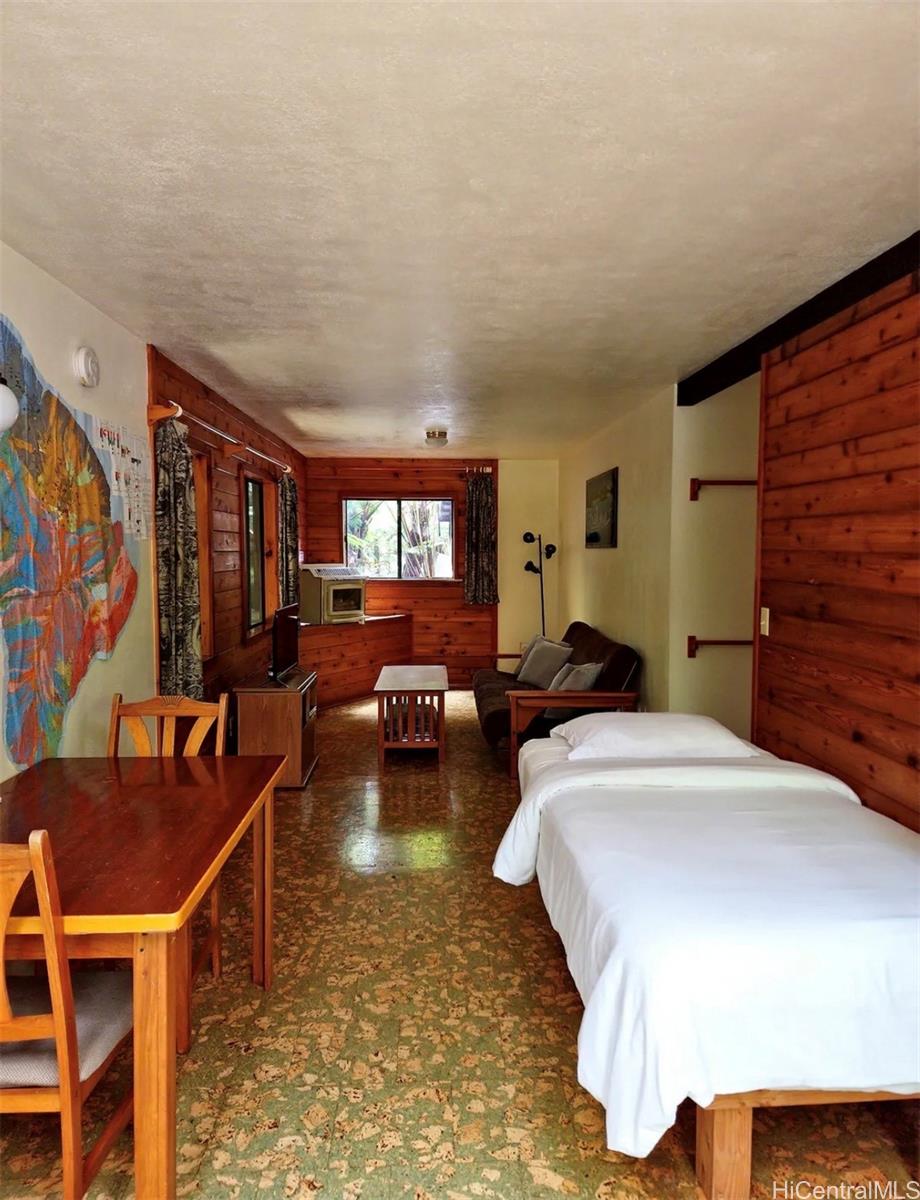 11-3832 2nd Street Volcano, HI 96785 - Photo 17 of 25 a living room with furniture and a flat screen tv