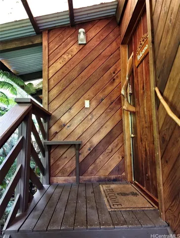 a view of backyard with wooden wall