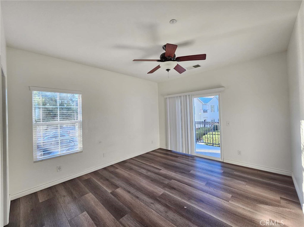 7331 Shelby Place, Unit 121 Rancho Cucamonga, CA 91739 - Photo 16 of 20 wooden floor in an empty room with a window
