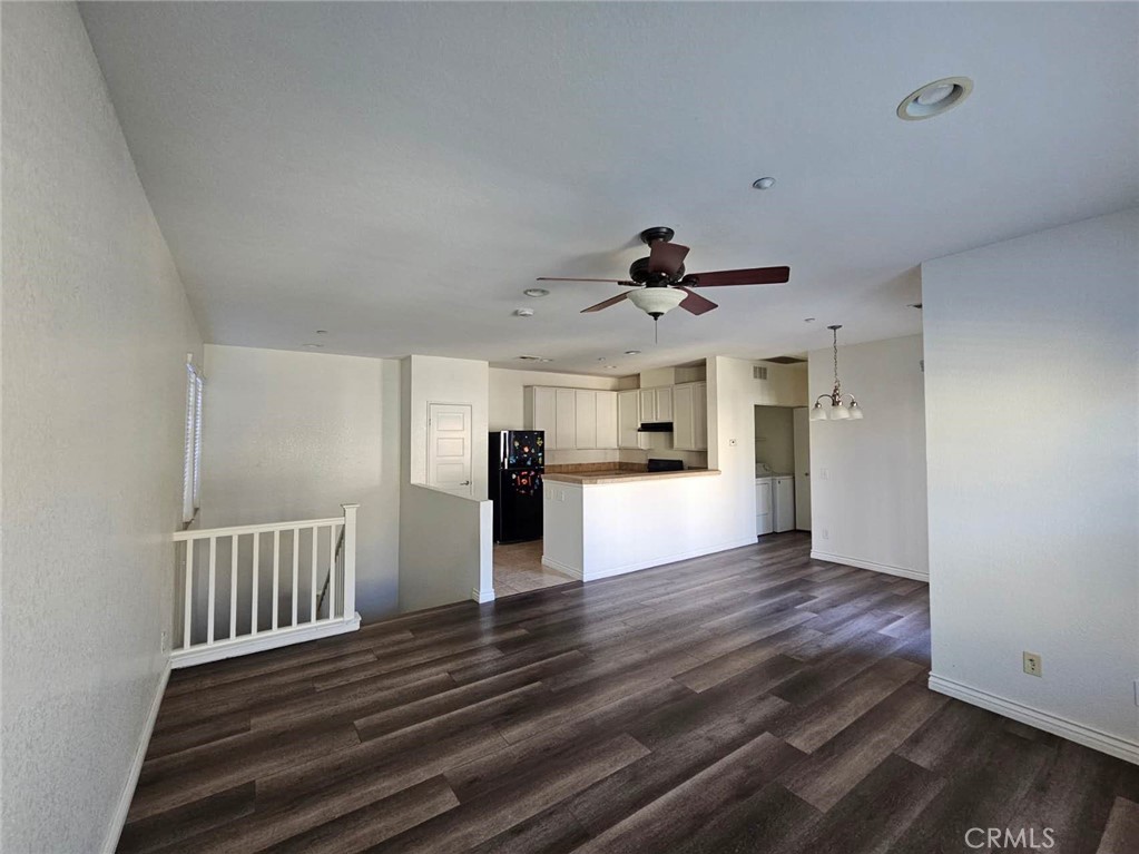 7331 Shelby Place, Unit 121 Rancho Cucamonga, CA 91739 - Photo 4 of 20 a view of empty room with wooden floor and window