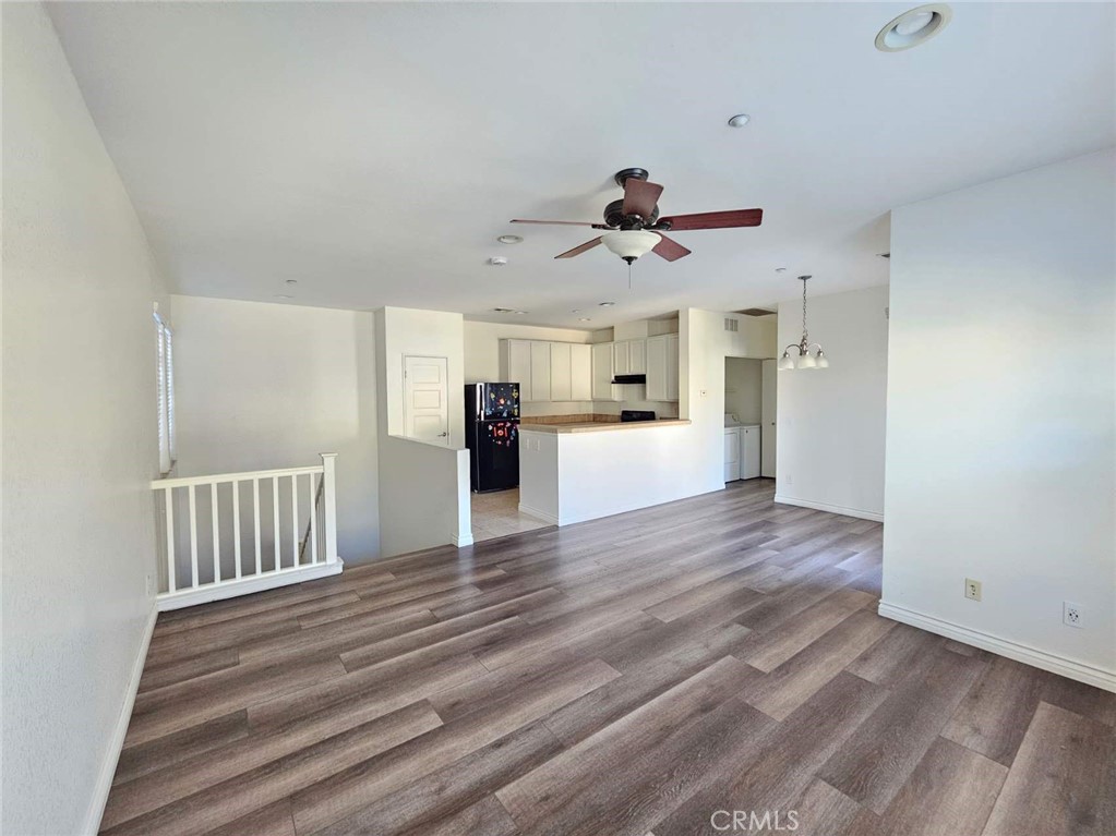 7331 Shelby Place, Unit 121 Rancho Cucamonga, CA 91739 - Photo 6 of 20 a view of kitchen with furniture and wooden floor