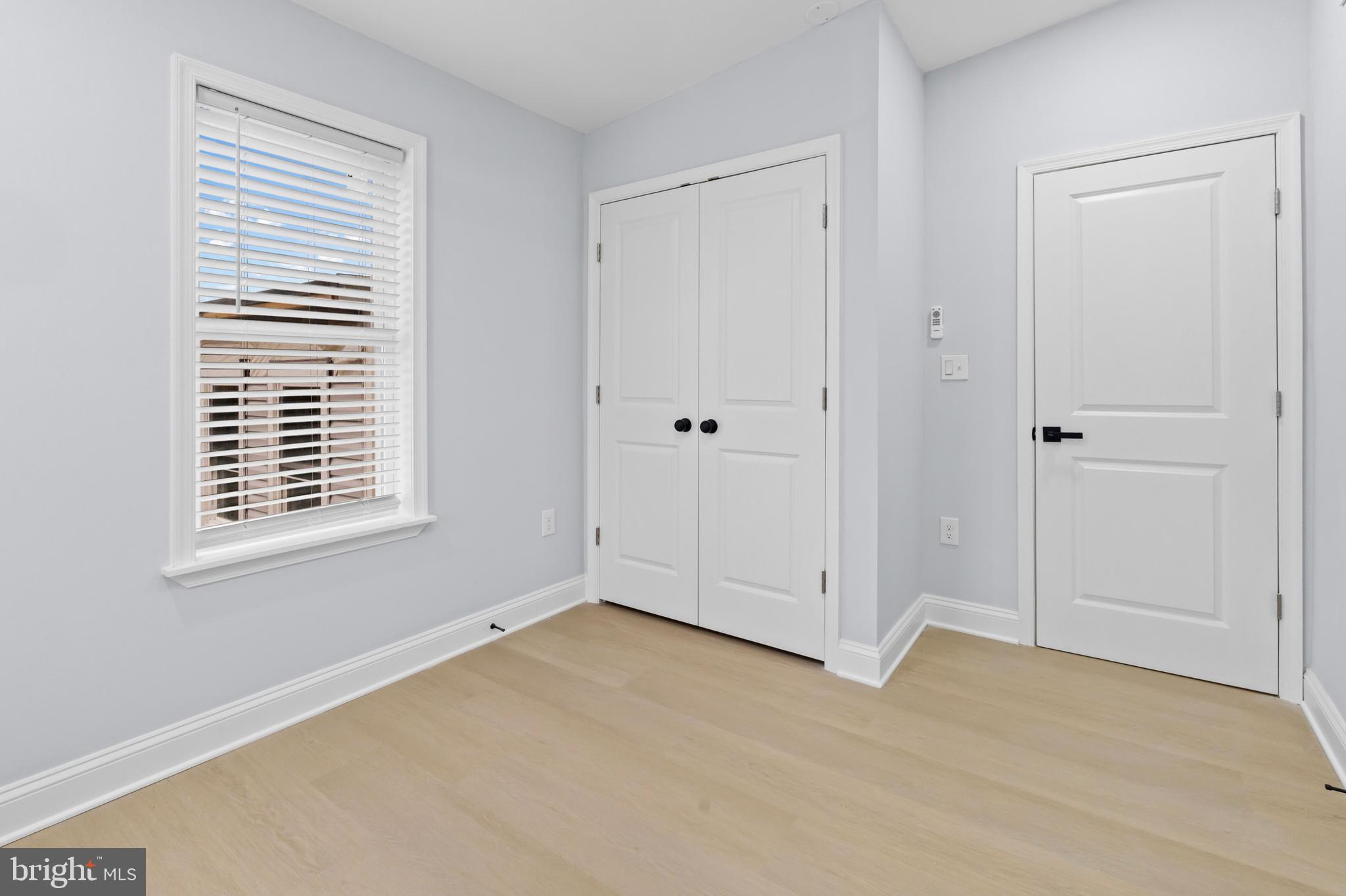 1612 East Chase Street Baltimore, MD 21213 - Photo 15 of 48 a view of an empty room with a window
