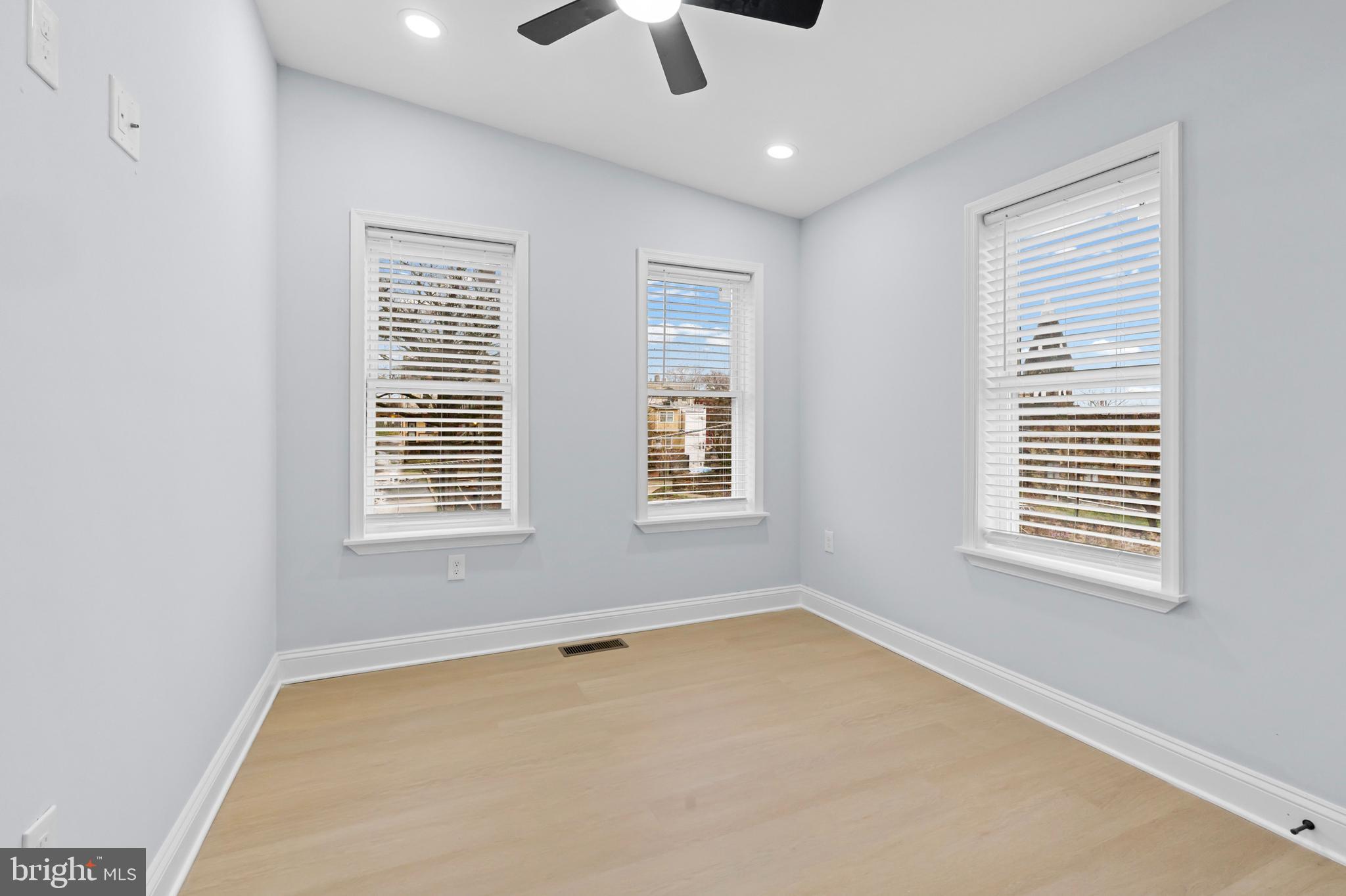 1612 East Chase Street Baltimore, MD 21213 - Photo 16 of 48 a view of an empty room with a window