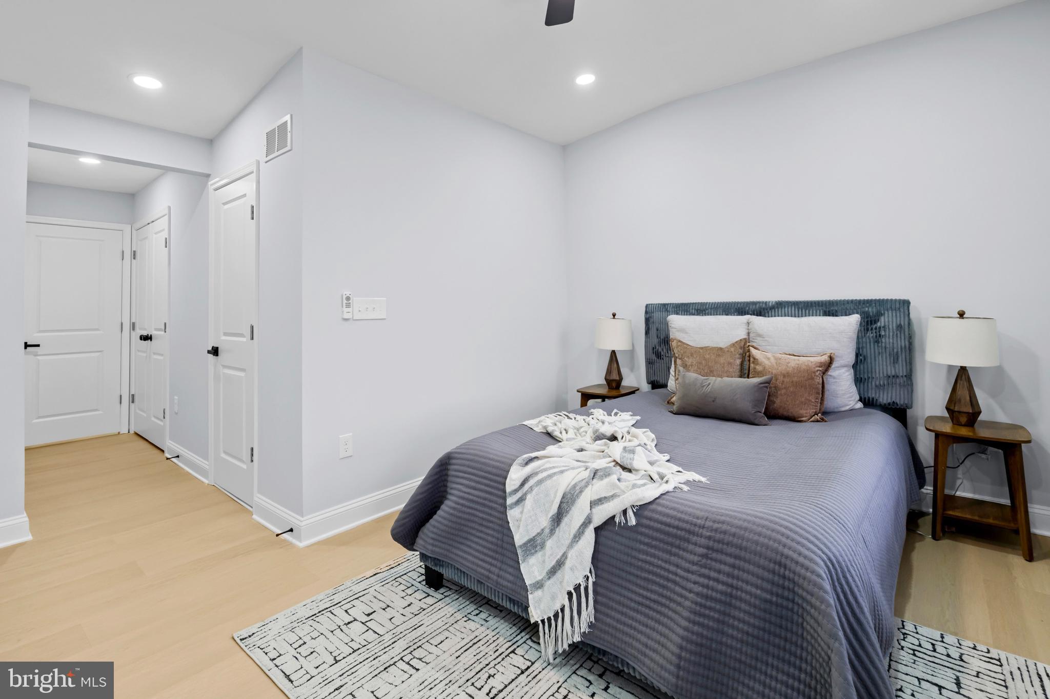 1612 East Chase Street Baltimore, MD 21213 - Photo 21 of 48 a bed room with a bed and a painting