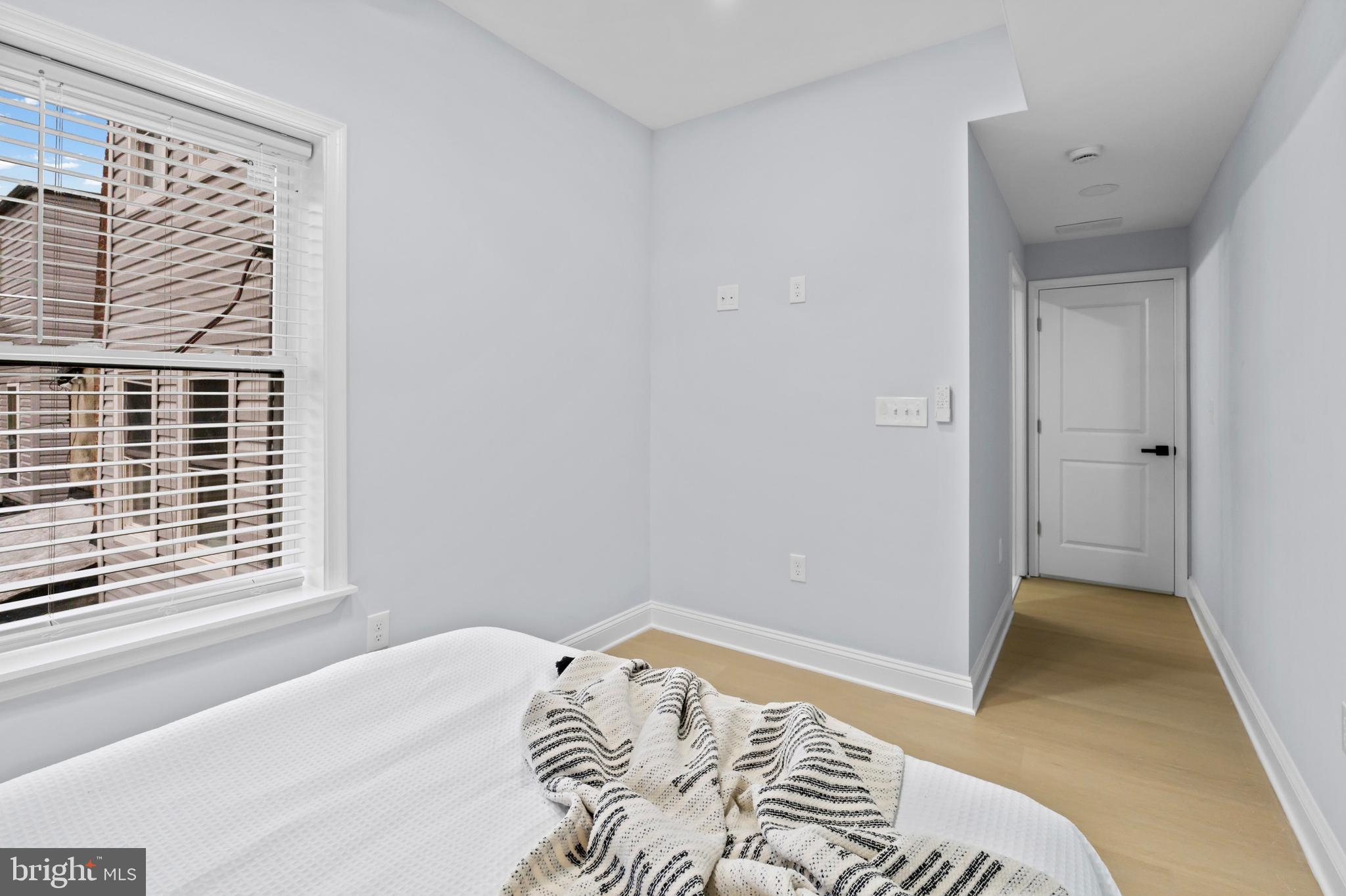 1612 East Chase Street Baltimore, MD 21213 - Photo 24 of 48 a bedroom with a bed and a window