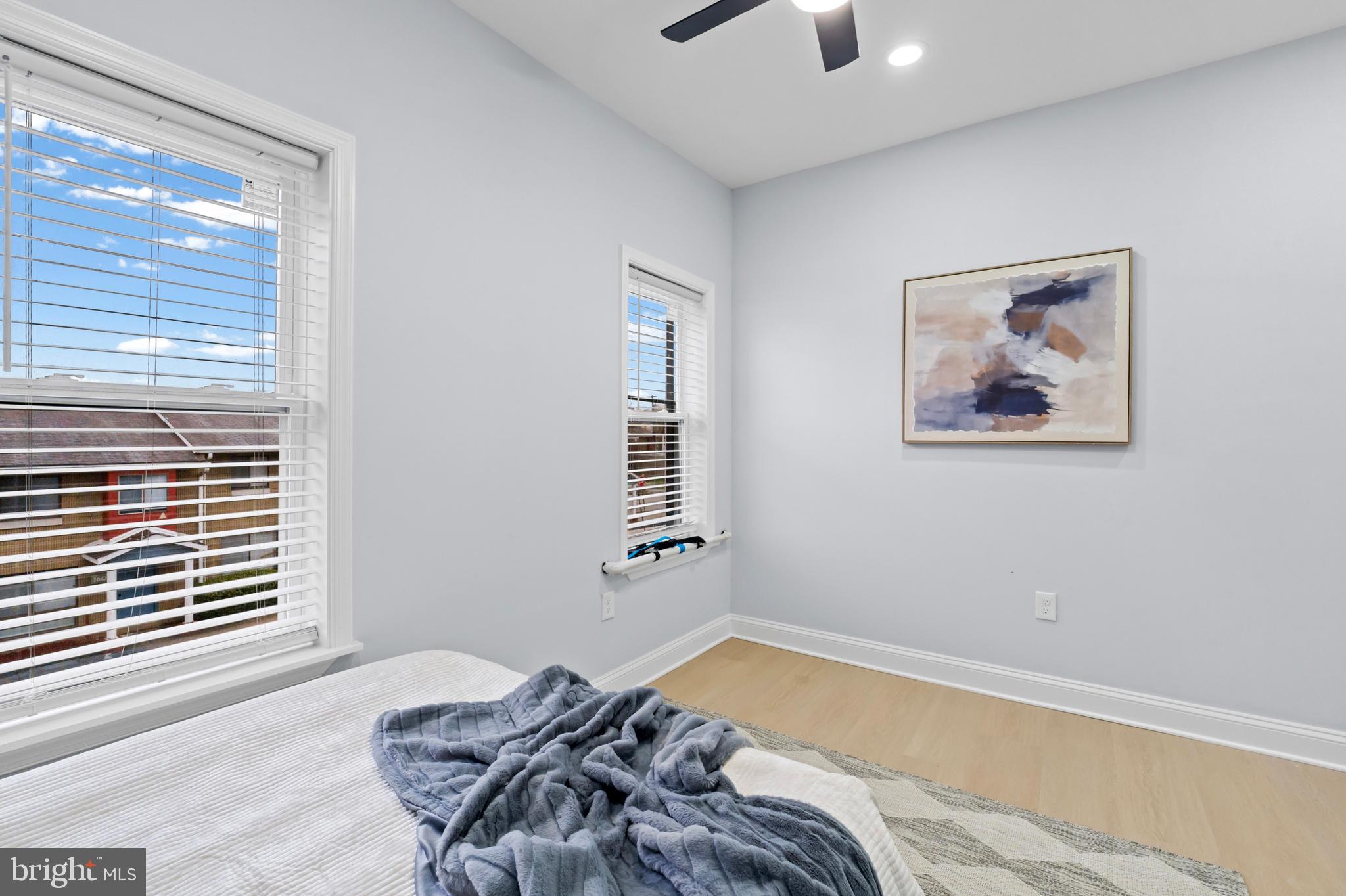 1612 East Chase Street Baltimore, MD 21213 - Photo 26 of 48 a bedroom with a bed and a window