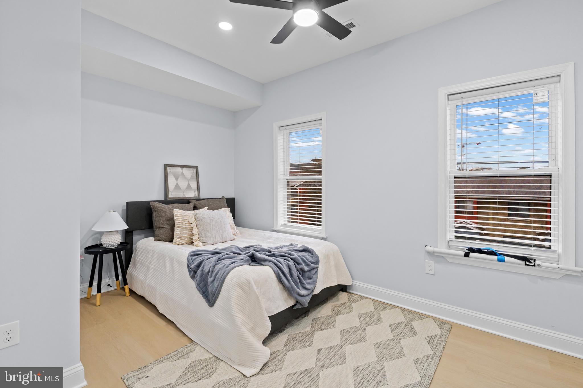 1612 East Chase Street Baltimore, MD 21213 - Photo 27 of 48 a bedroom with a bed and a window