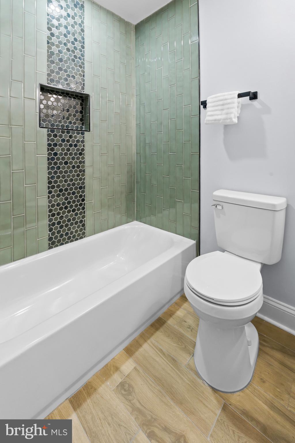 1612 East Chase Street Baltimore, MD 21213 - Photo 31 of 48 a bathroom with a toilet and a shower