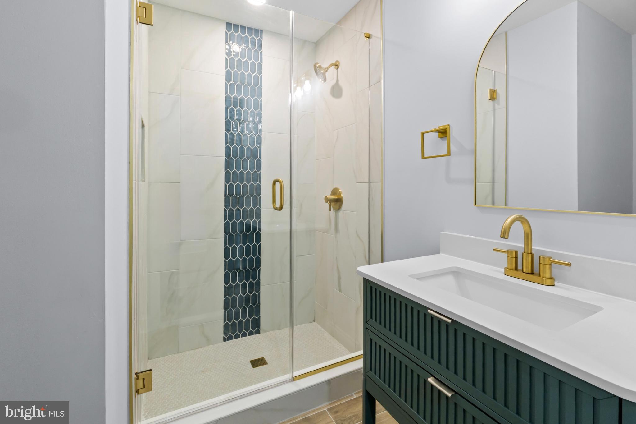 1612 East Chase Street Baltimore, MD 21213 - Photo 32 of 48 a bathroom with a sink and a mirror