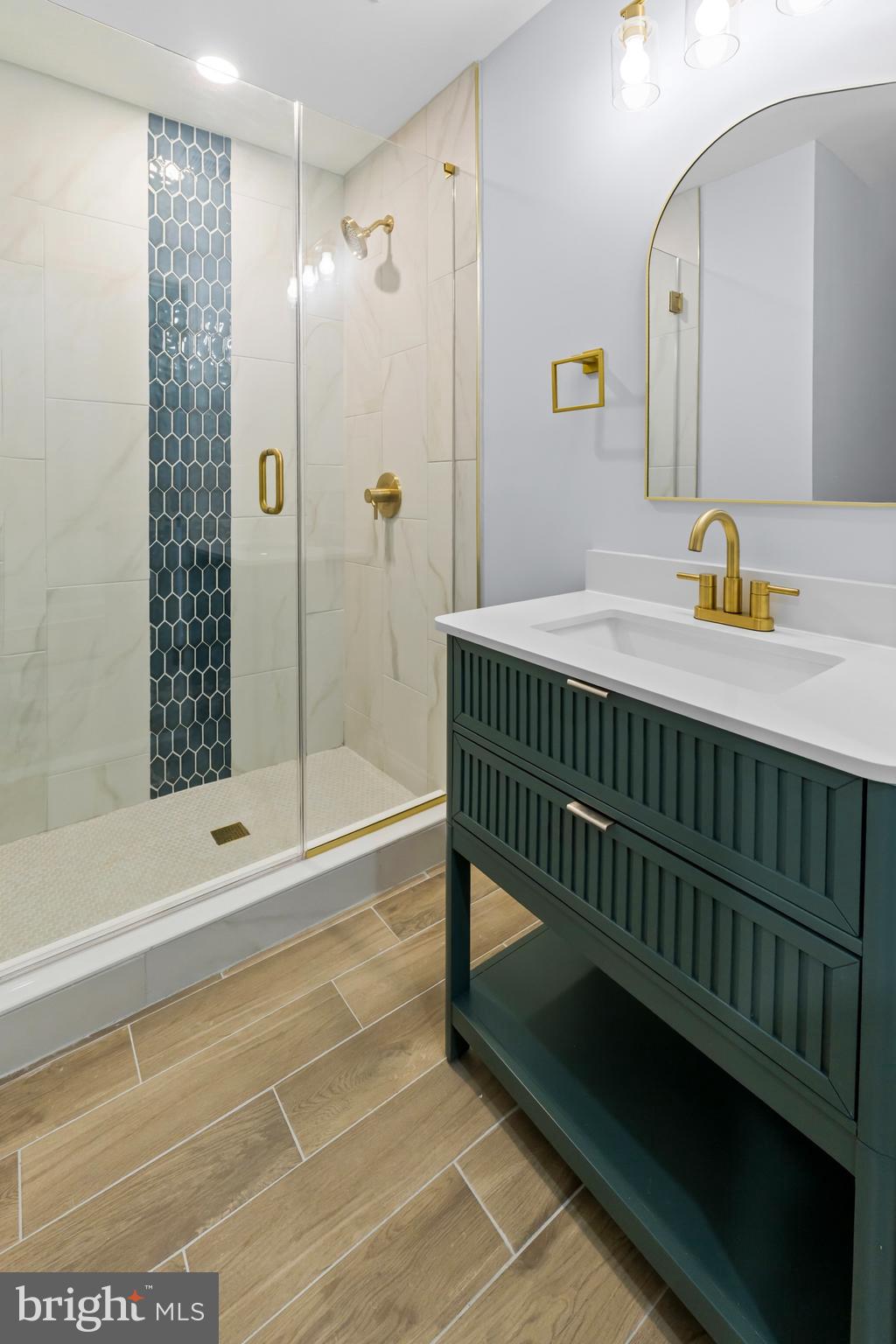 1612 East Chase Street Baltimore, MD 21213 - Photo 33 of 48 a bathroom with a sink and a mirror