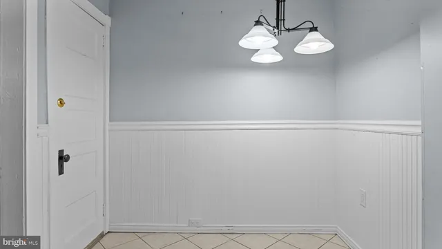 a view of a small space with wooden floor and a sink