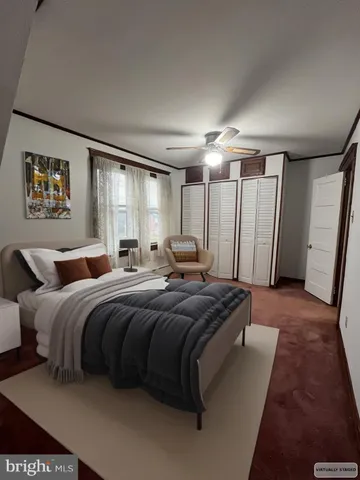 a bedroom with bed and a large mirror