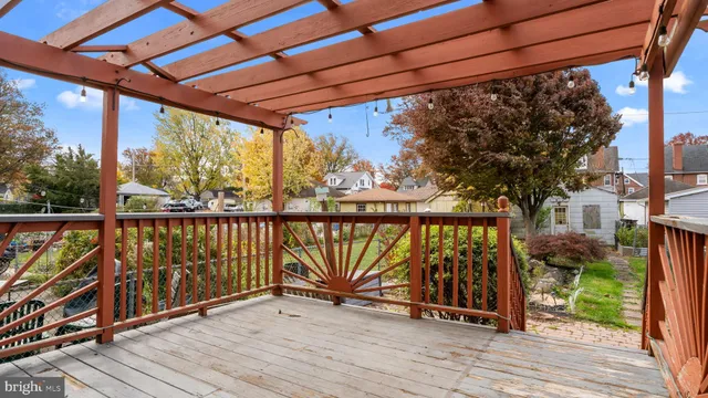 a view of balcony with wooden floor and fence