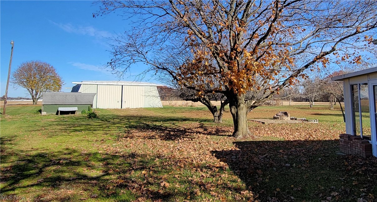 405 Bryan Road Milan, OH 44846 - Photo 27 of 35 View of yard featuring an outdoor structure