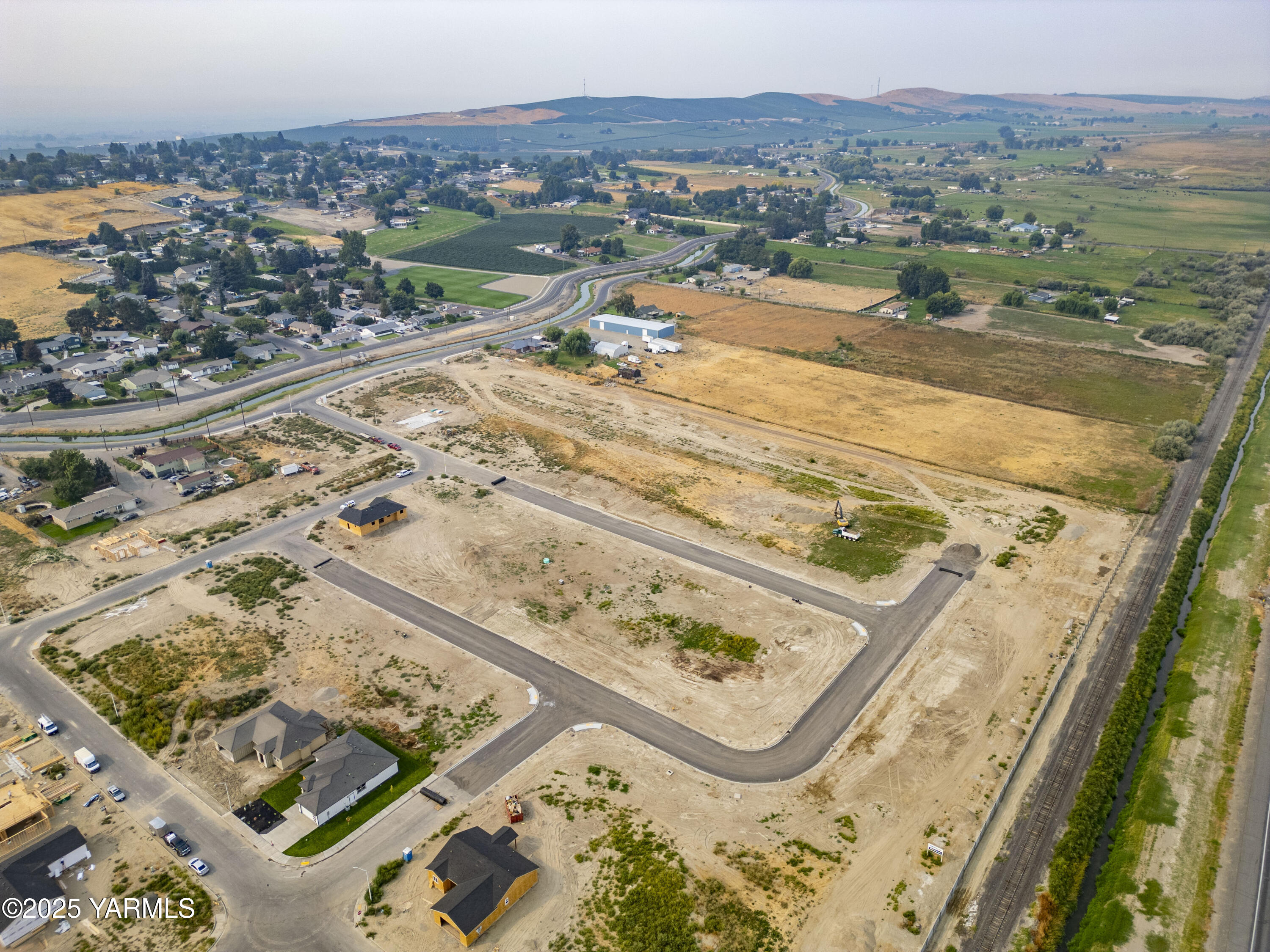 Tbd Tbd Estates Sunnyside, WA 98944 - Photo 9 of 11 an aerial view of residential houses with outdoor space