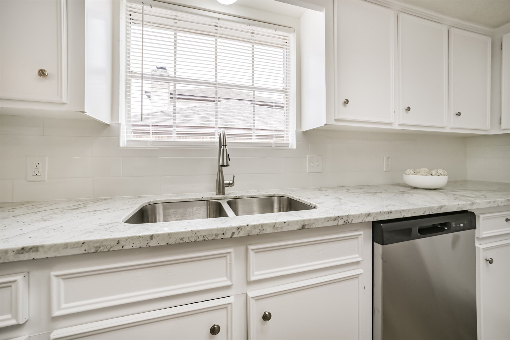 1011 Baltic Lane Houston, TX 77090 - Photo 14 of 43 a kitchen with granite countertop a sink and a window