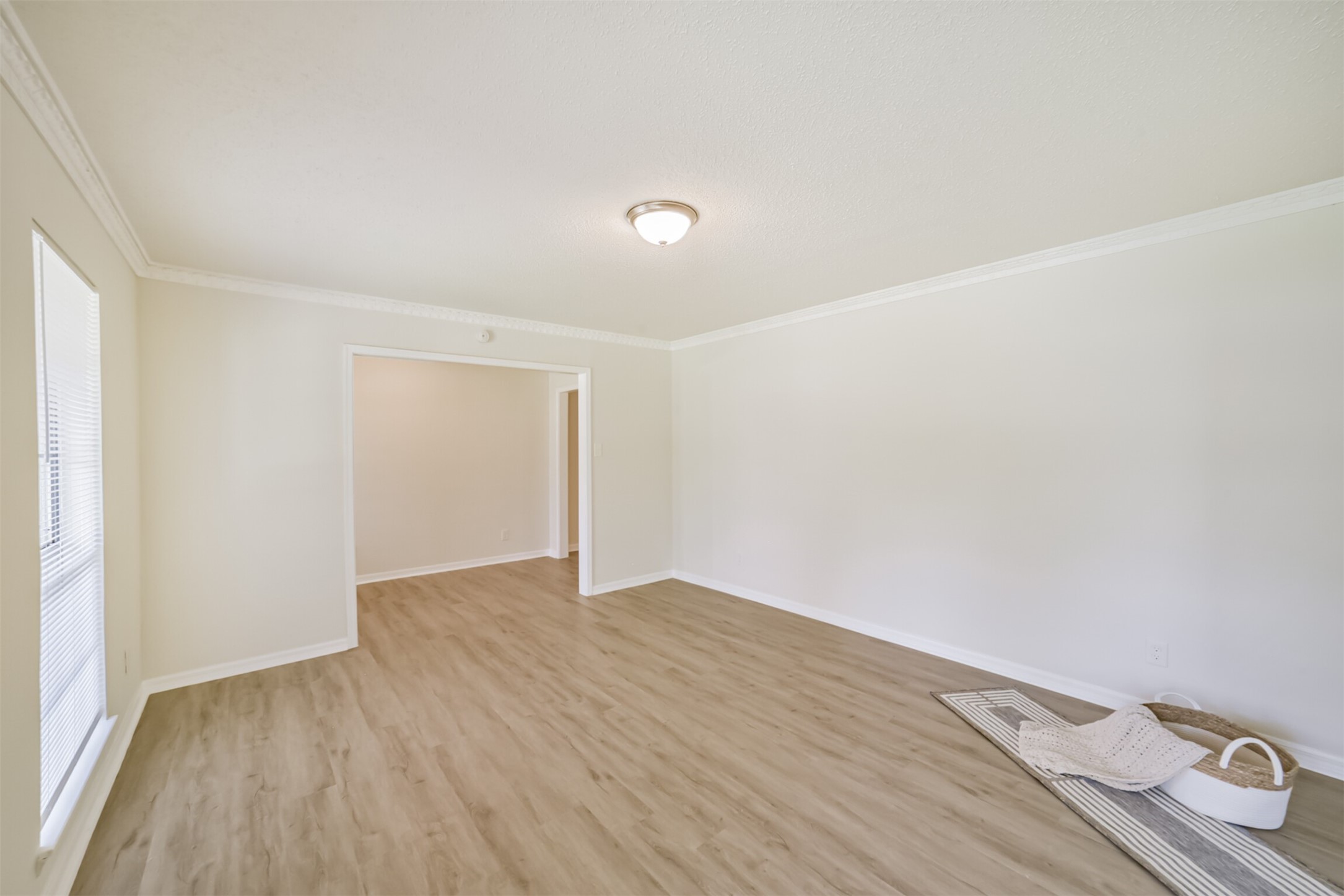 1011 Baltic Lane Houston, TX 77090 - Photo 18 of 43 a view of an empty room with wooden floor