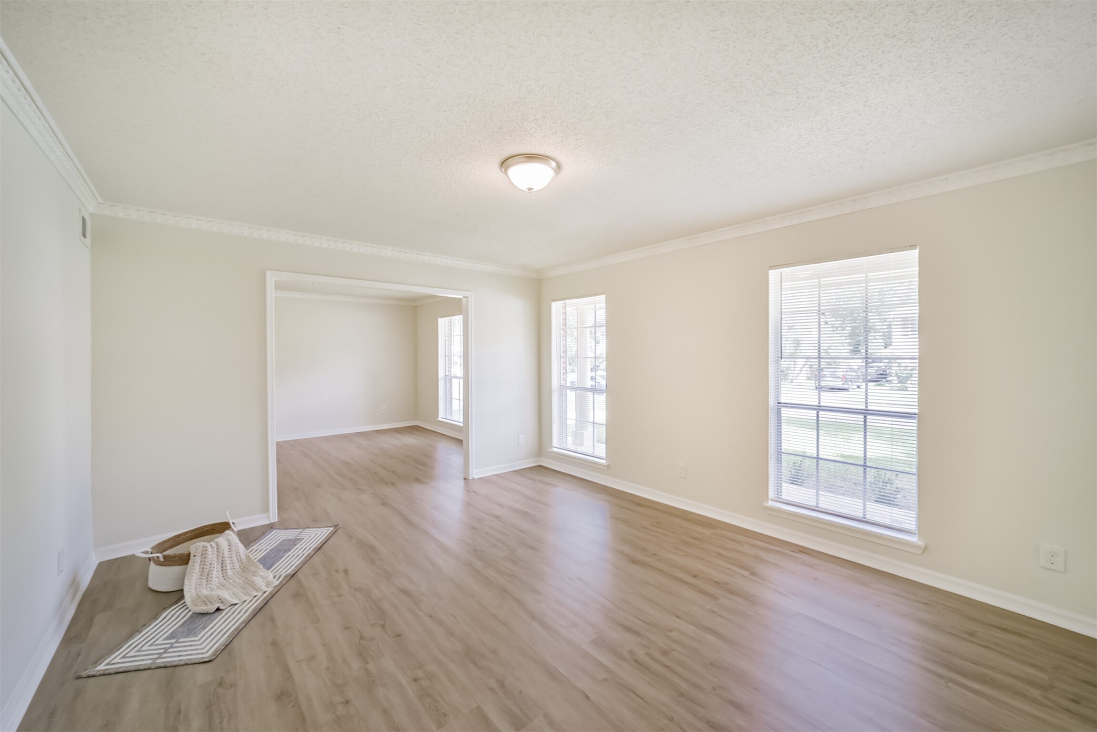 1011 Baltic Lane Houston, TX 77090 - Photo 19 of 43 wooden floor in an empty room with a window