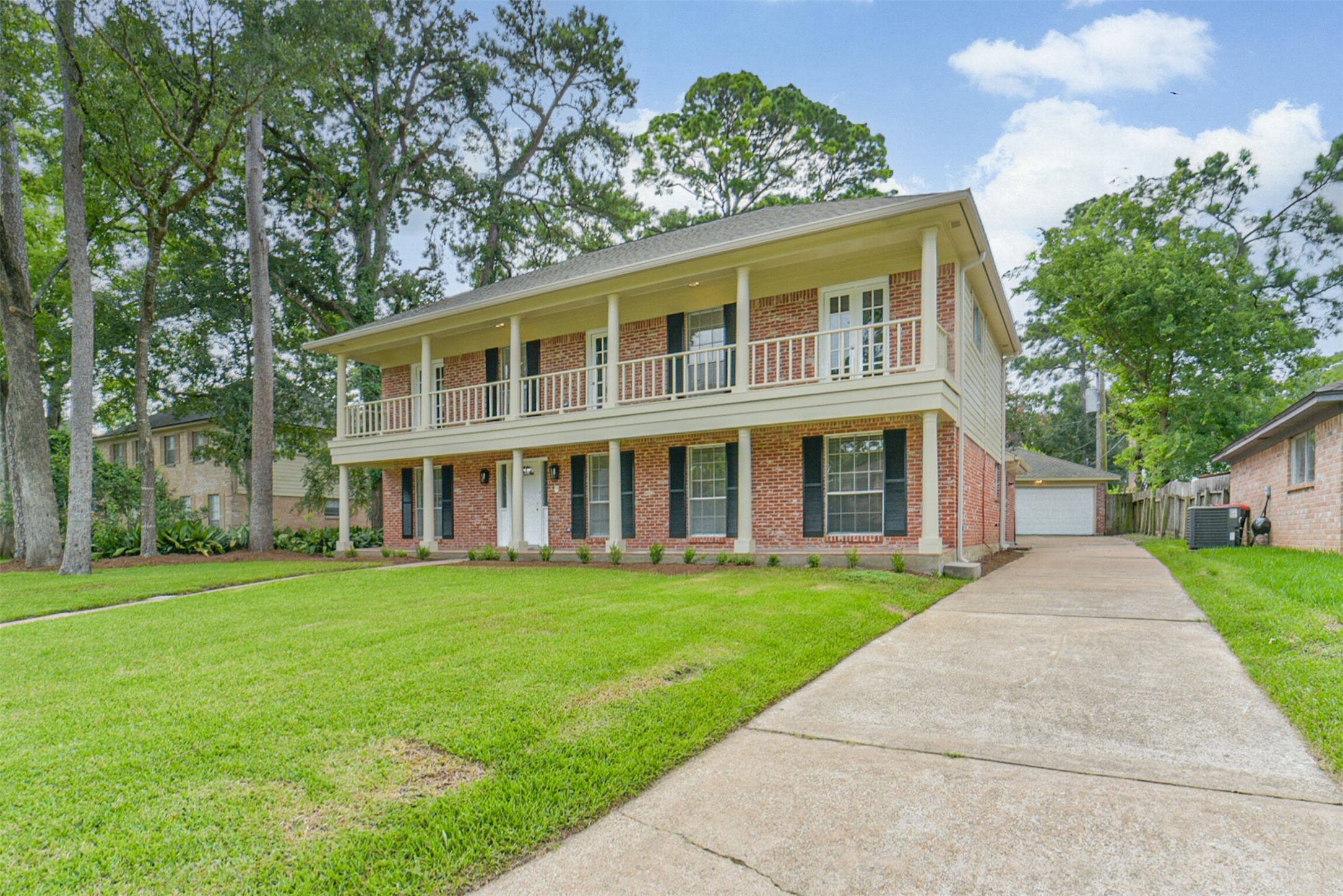 1011 Baltic Lane Houston, TX 77090 - Photo 2 of 43 front view of a house with a yard