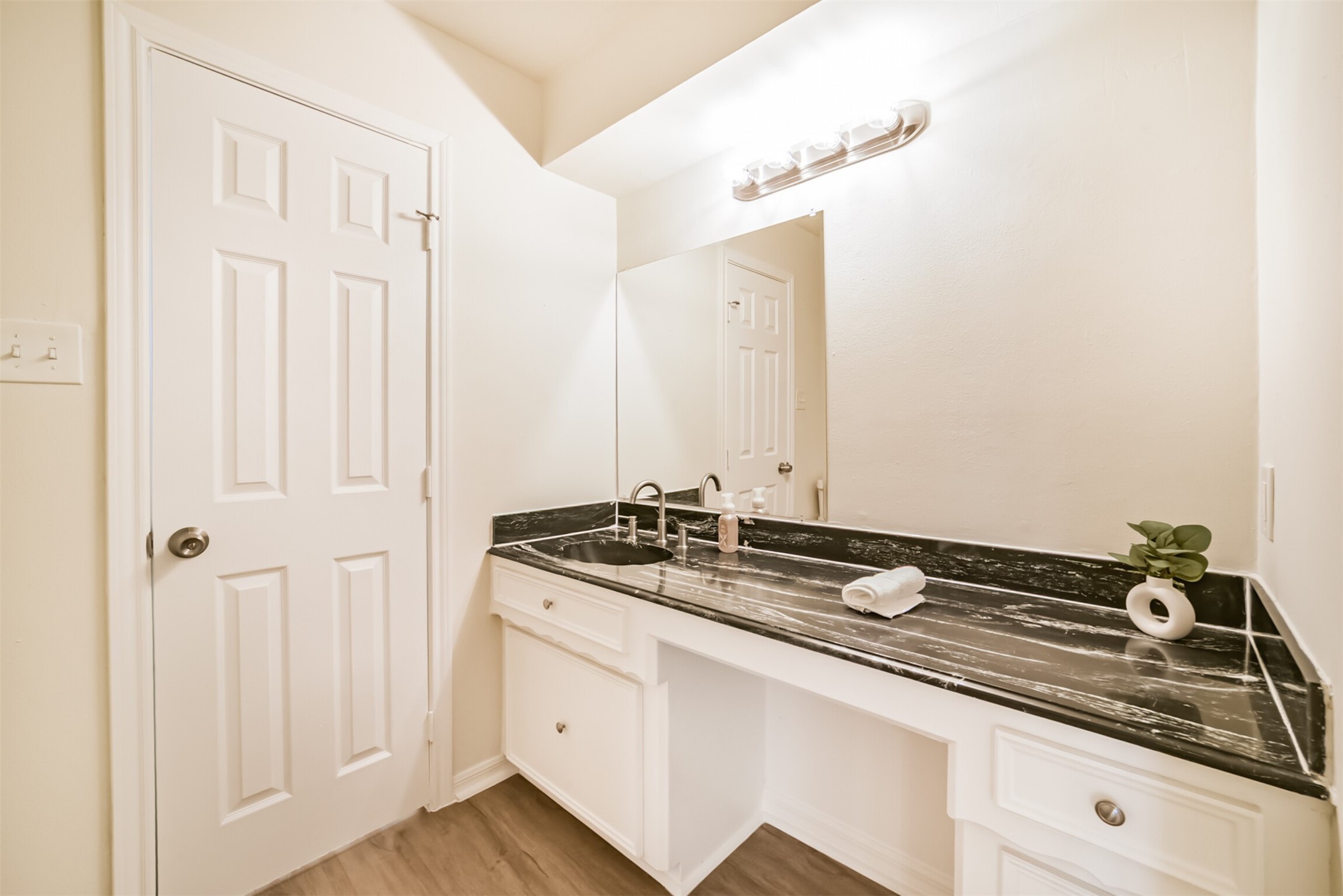 1011 Baltic Lane Houston, TX 77090 - Photo 32 of 43 a bathroom with a sink and a mirror