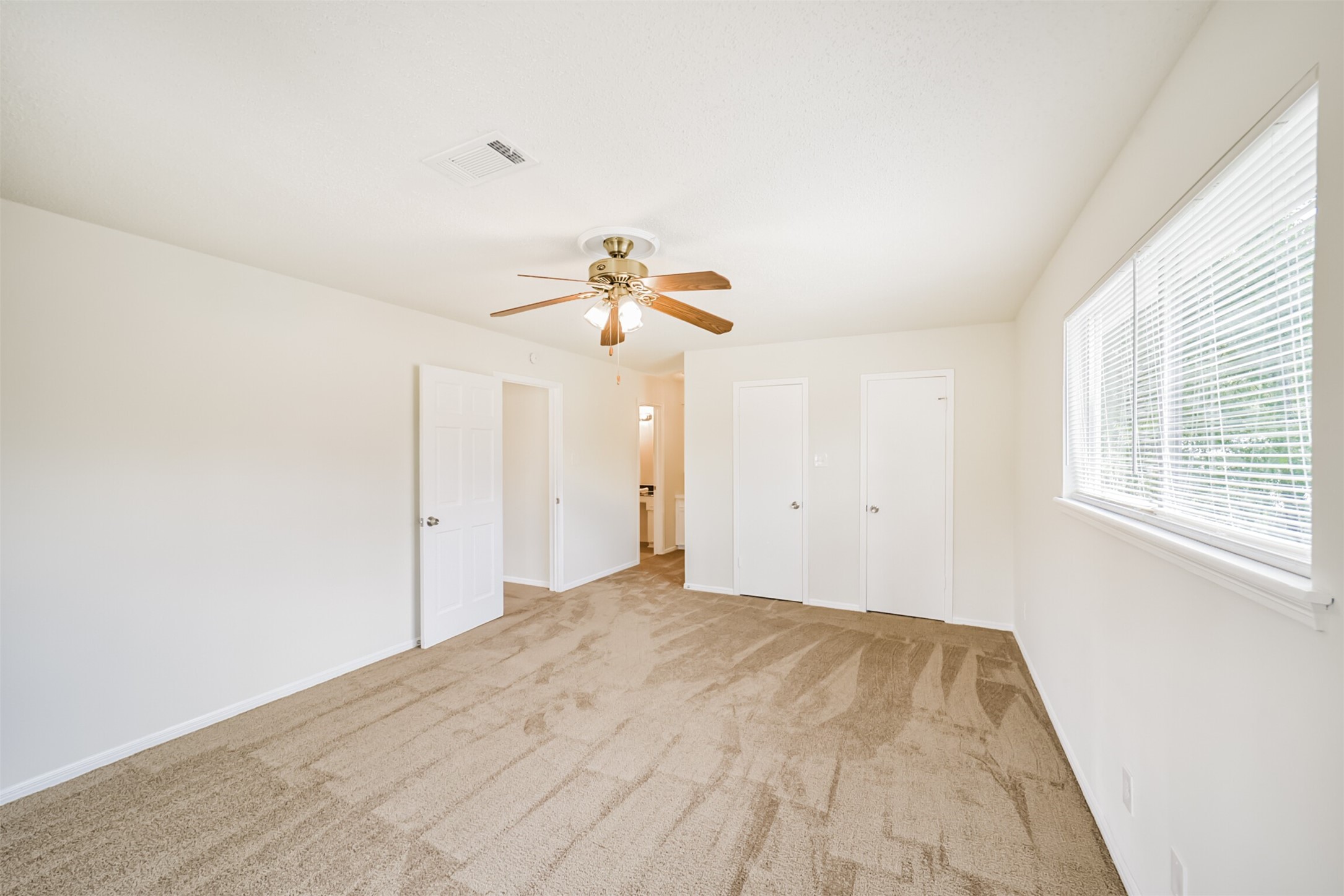 1011 Baltic Lane Houston, TX 77090 - Photo 34 of 43 a view of a room with a window and ceiling fan