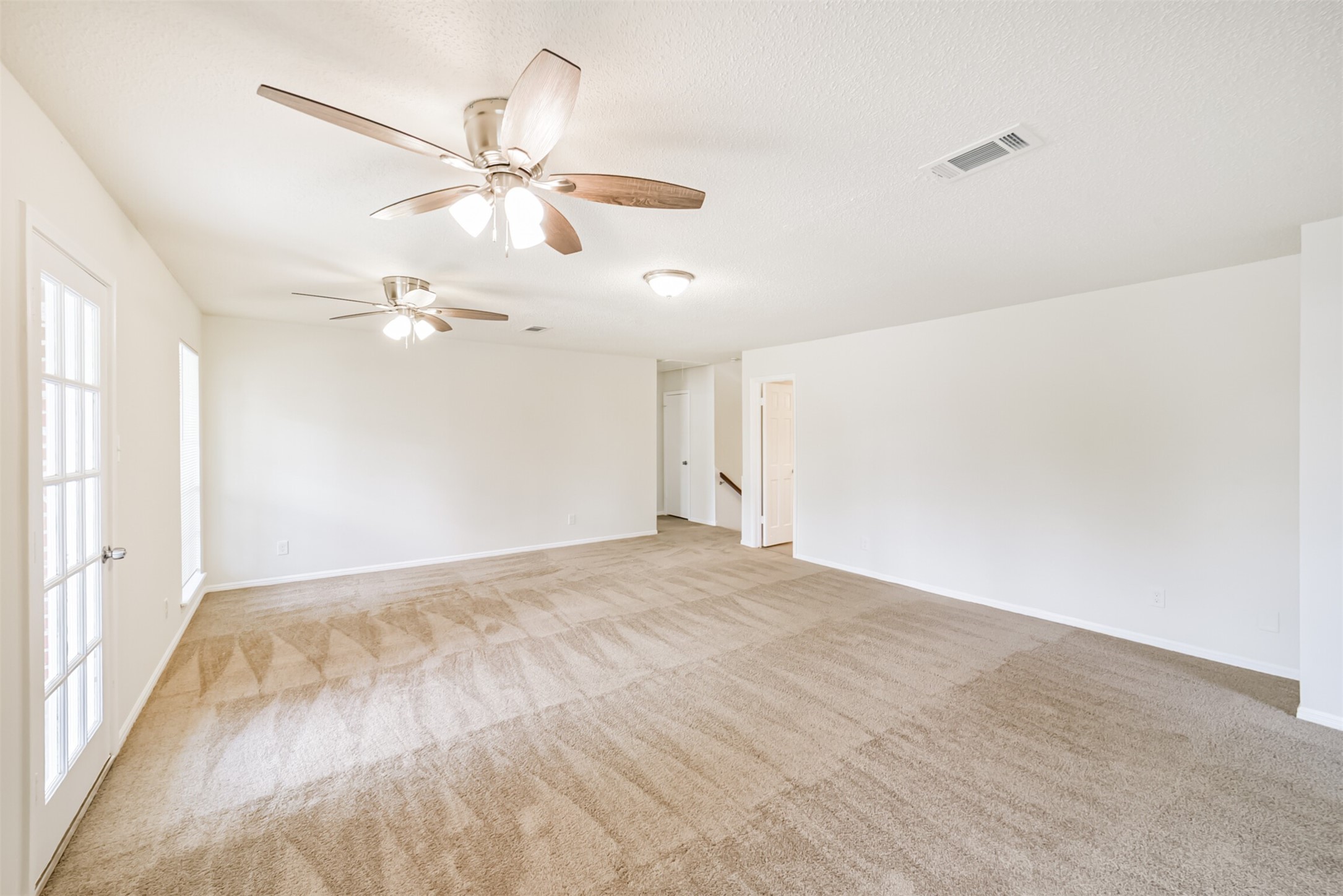 1011 Baltic Lane Houston, TX 77090 - Photo 35 of 43 a view of a room with a ceiling fan