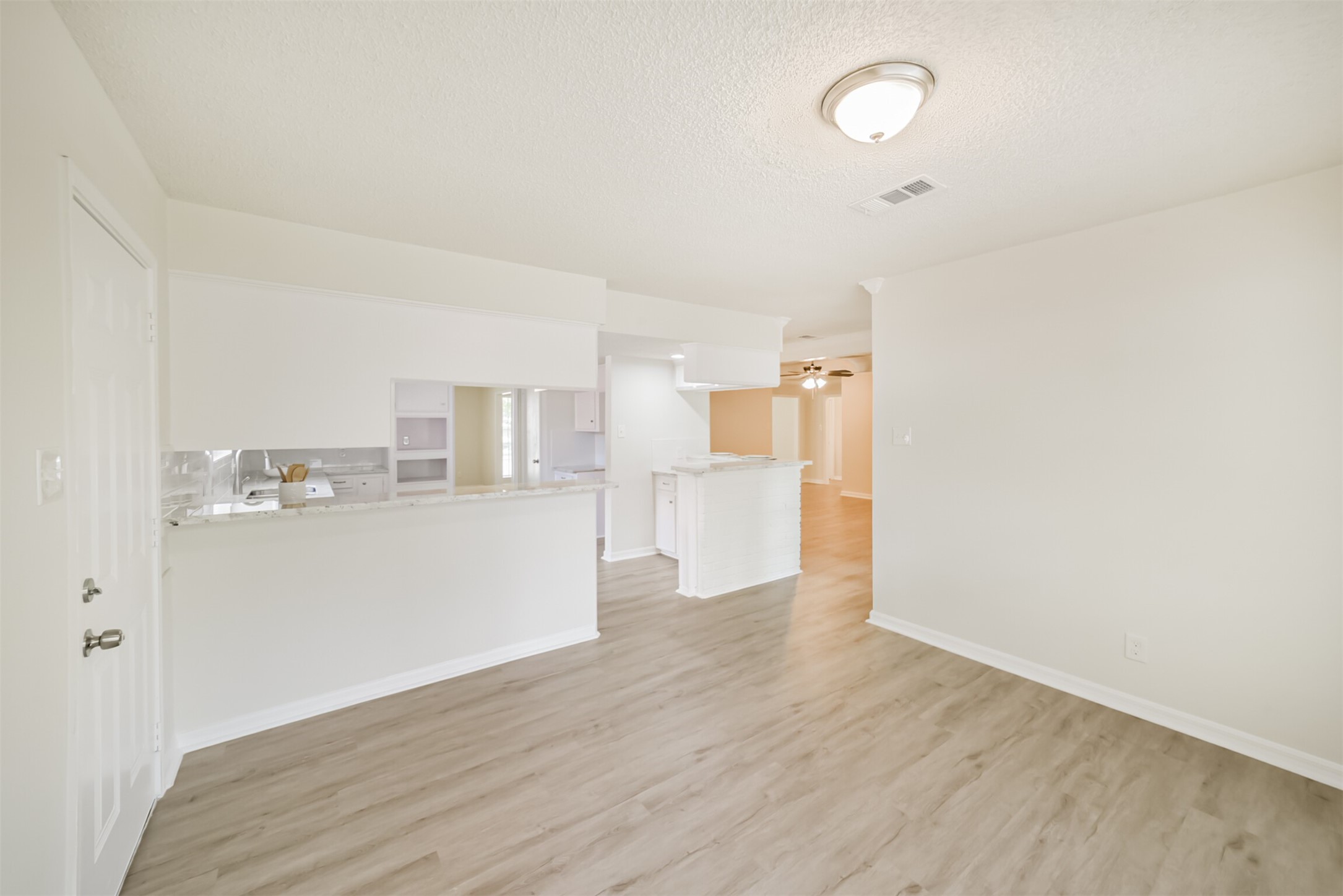 1011 Baltic Lane Houston, TX 77090 - Photo 8 of 43 a view of a kitchen with wooden floor