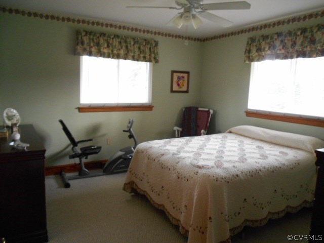 10 Jamestown Road Farmville, VA 23901 - Photo 9 of 20 a bed sitting in a bedroom next to a window