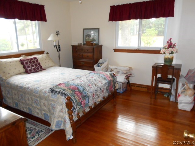 10 Jamestown Road Farmville, VA 23901 - Photo 10 of 20 a bedroom with a bed and wooden floor
