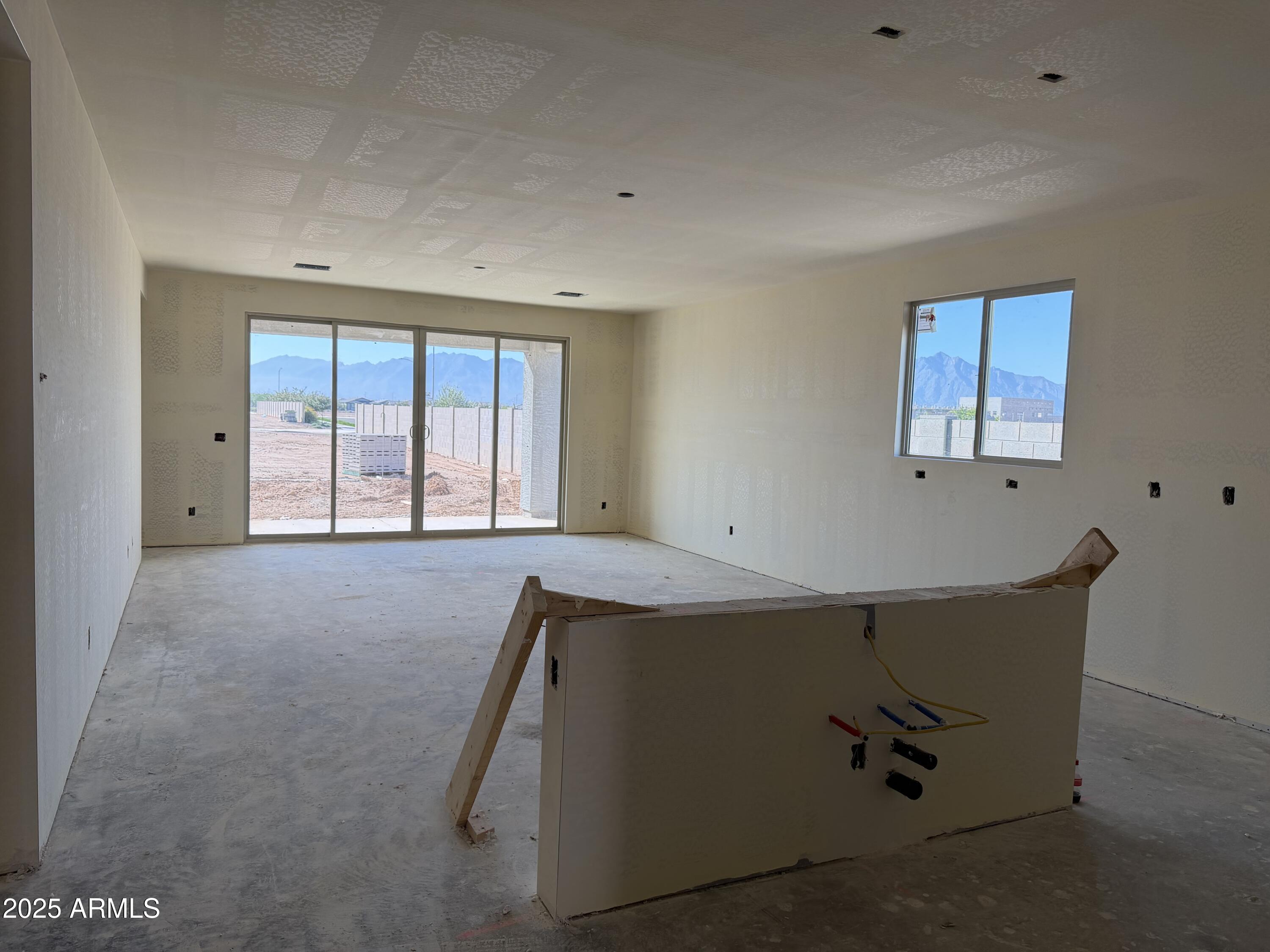 5613 West Hopi Trail Laveen, AZ 85339 - Photo 4 of 25 a view of an empty room with a window