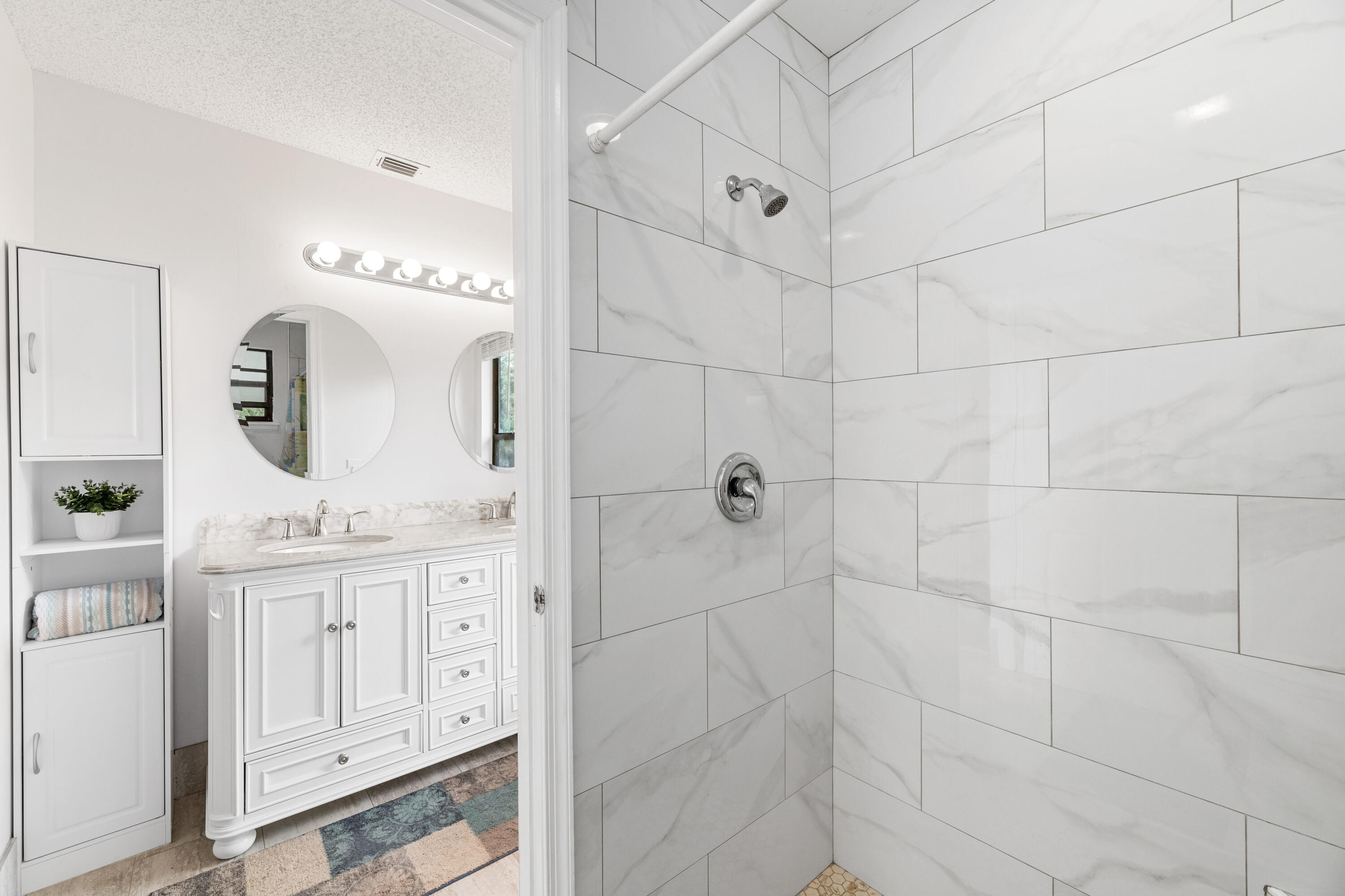 16887 West Cornwall Drive Loxahatchee, FL 33470 - Photo 13 of 37 a bathroom with a granite countertop sink a mirror and vanity