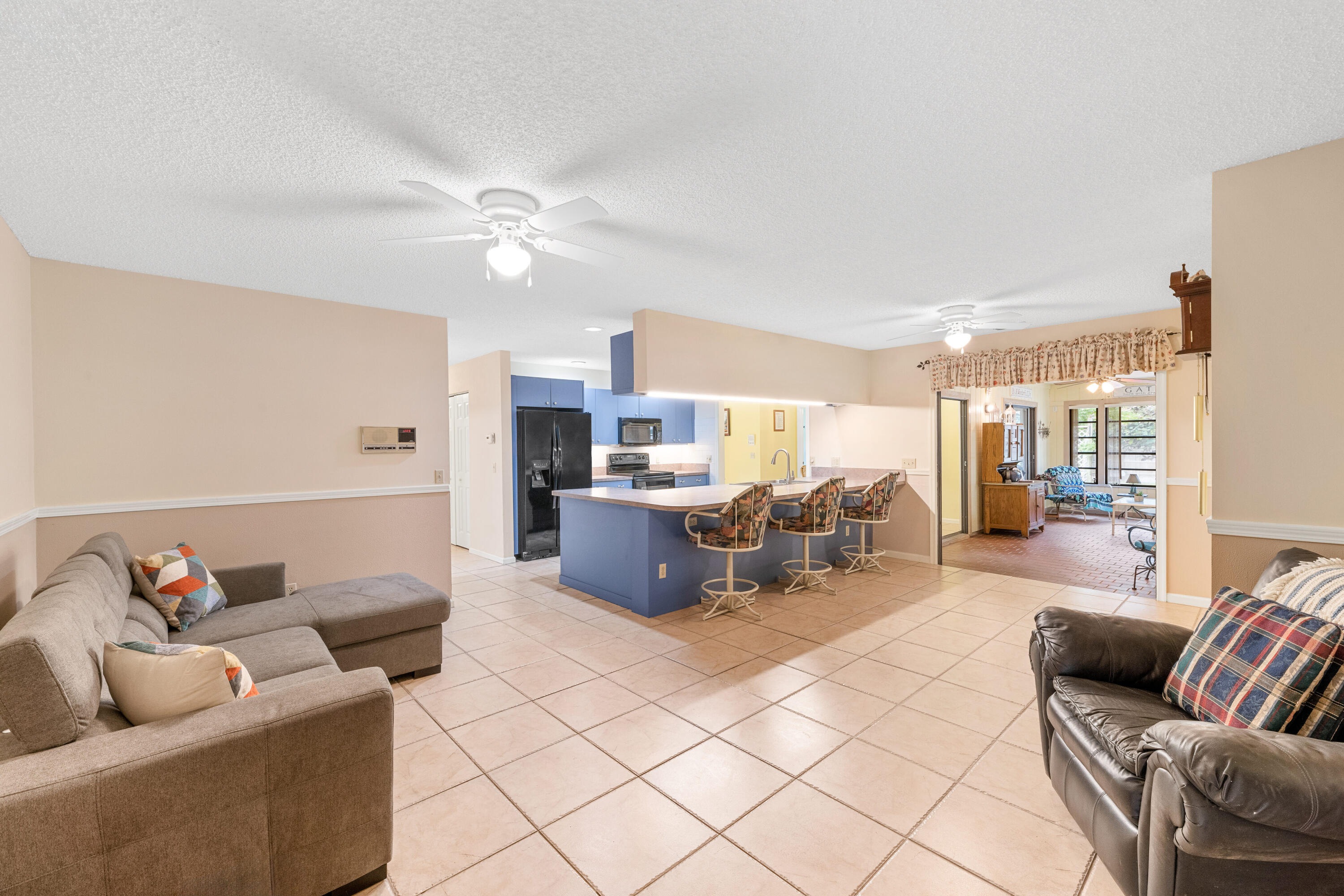 16887 West Cornwall Drive Loxahatchee, FL 33470 - Photo 15 of 37 a living room with furniture and a large window