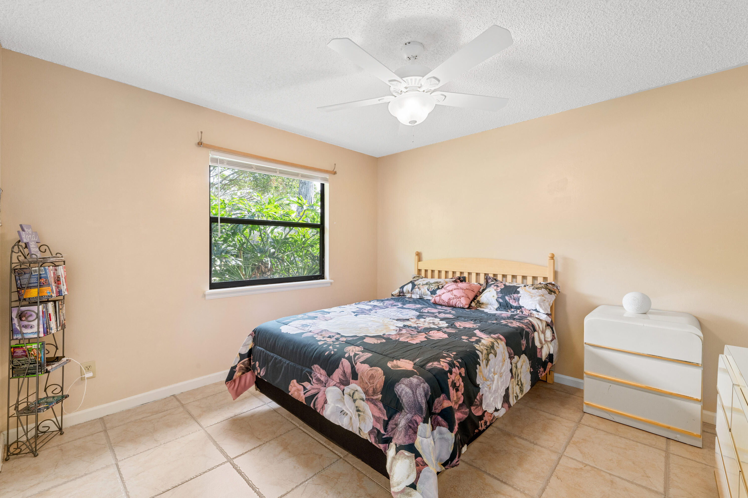 16887 West Cornwall Drive Loxahatchee, FL 33470 - Photo 17 of 37 a bedroom with a bed and window