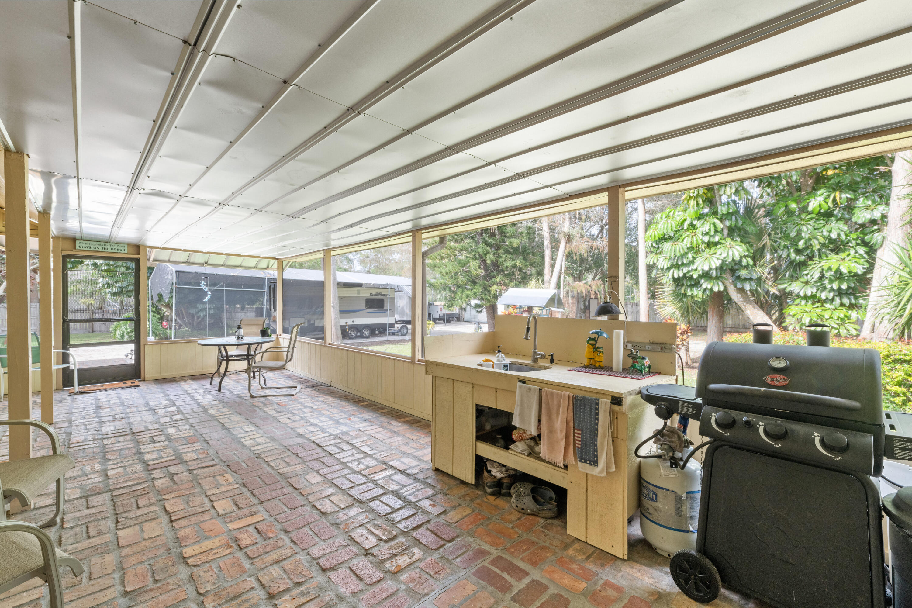 16887 West Cornwall Drive Loxahatchee, FL 33470 - Photo 26 of 37 a room with furniture and a large window